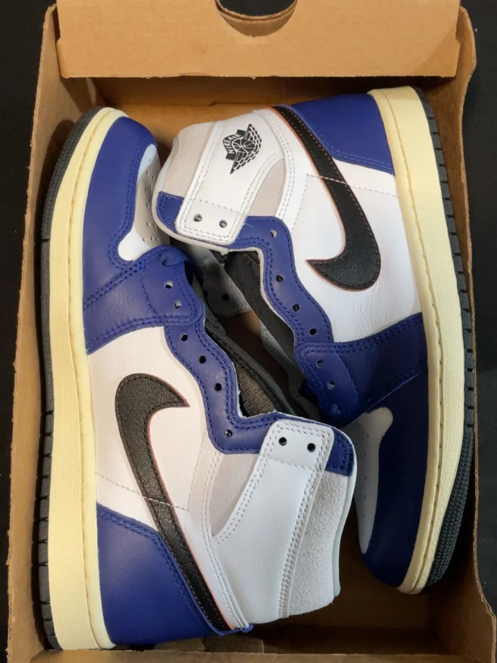 Nike Air Jordan 1 High in White and Blue with Black Swoosh